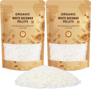 Two bags of beeswax pellets, with a small pile of the pellets in the front of the image 