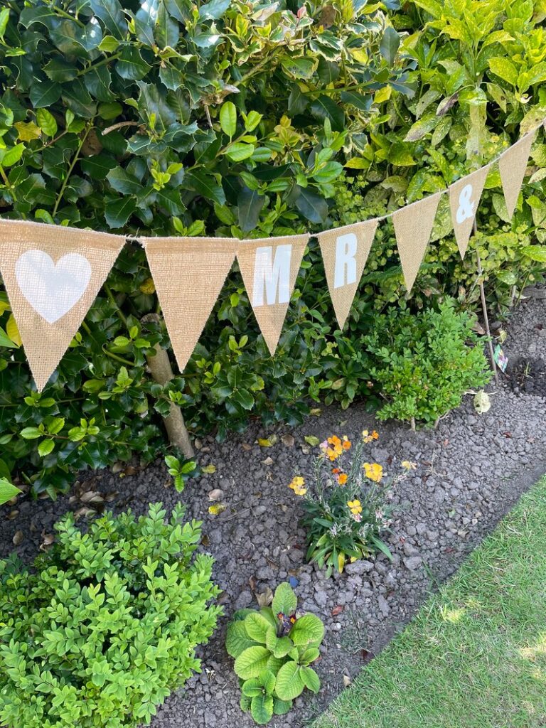 Image showing hessian bunting on display in a garden